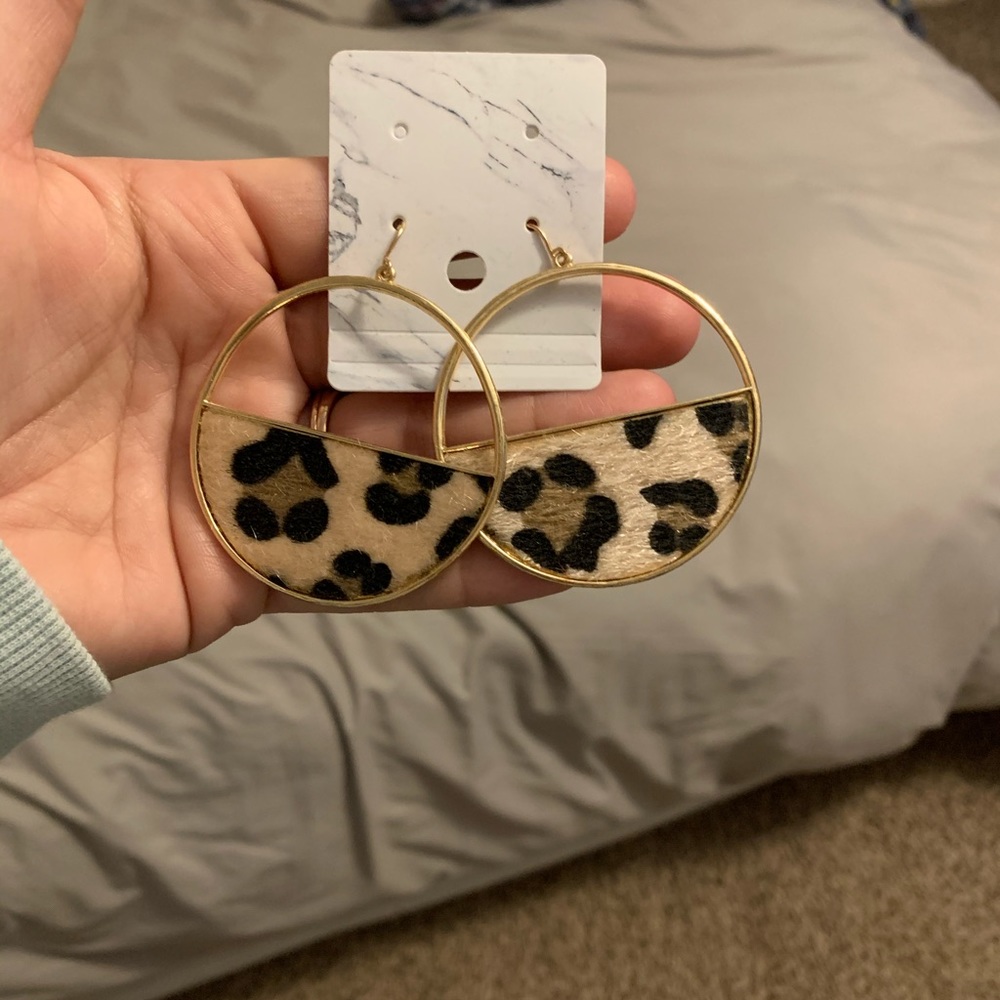 Gold and cheetah earrings.